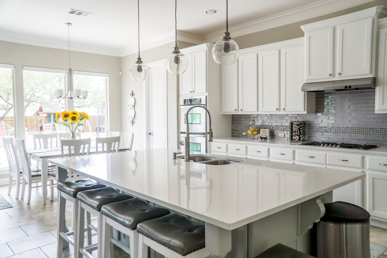 Crafting Captivating Headlines: Your awesome post title goes here Spacious modern kitchen with white cabinets and island in natural light.